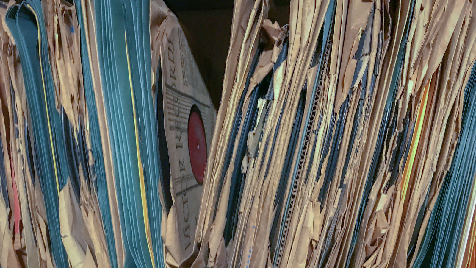 Shelves packed with old paper files and folders