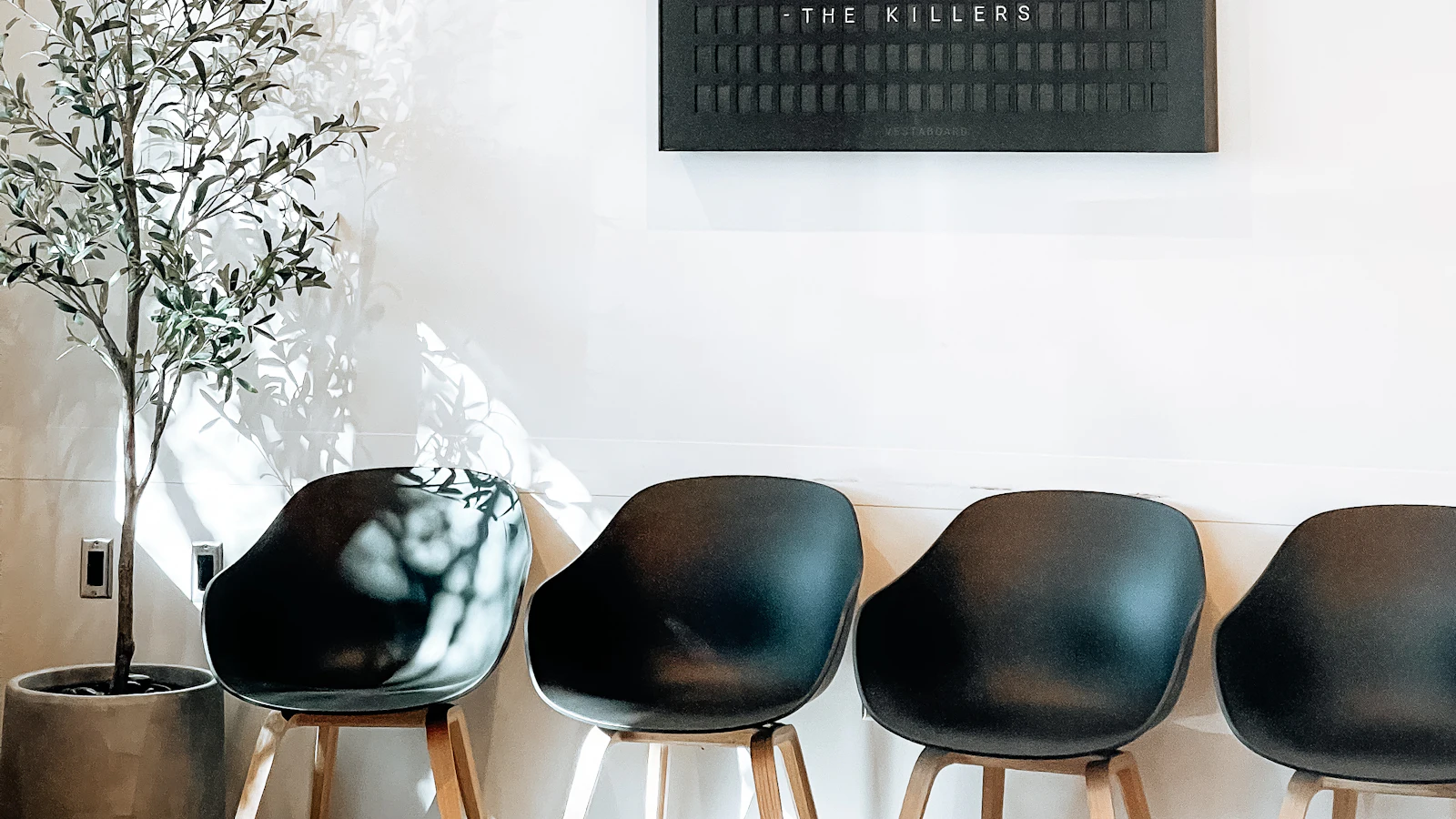 A modern, empty clinic waiting room with chairs